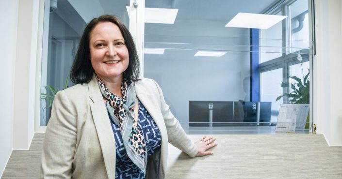 Police and Crime Commissioner Alison Hernandez standing in front of a police station front desk