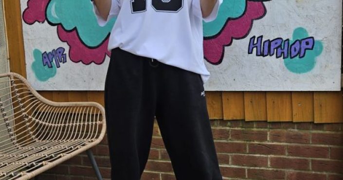 Alexandra Maria Radu stood in front of a board advertising her street dance classes