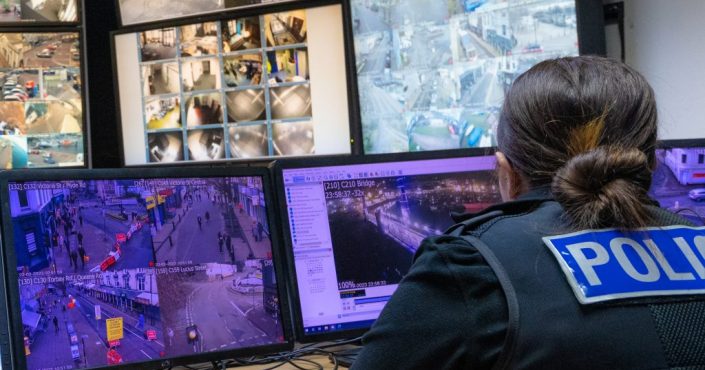 A CCTV control room in Torquay with cameras being monitored by a police officer