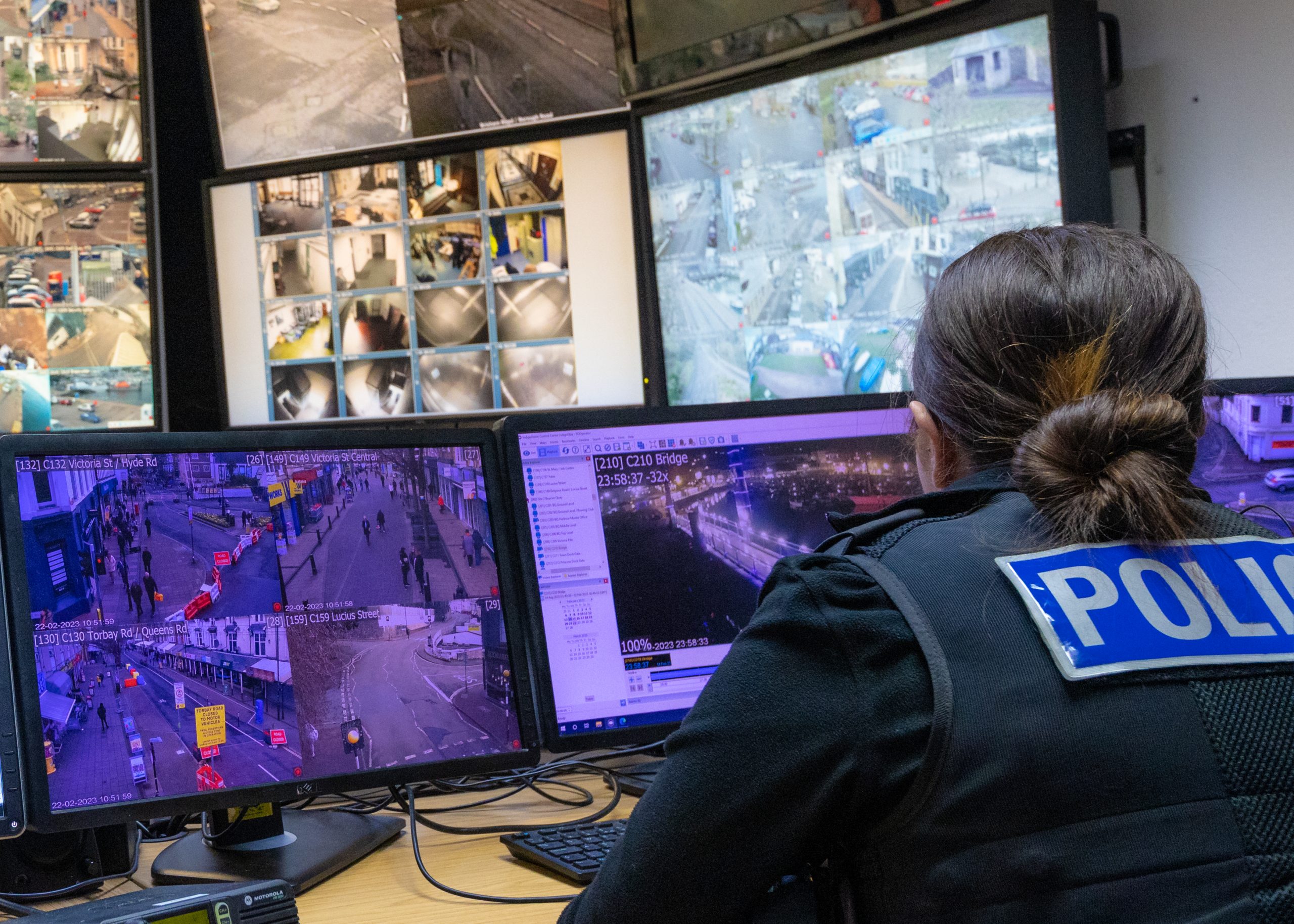 A CCTV control room in Torquay with cameras being monitored by a police officer