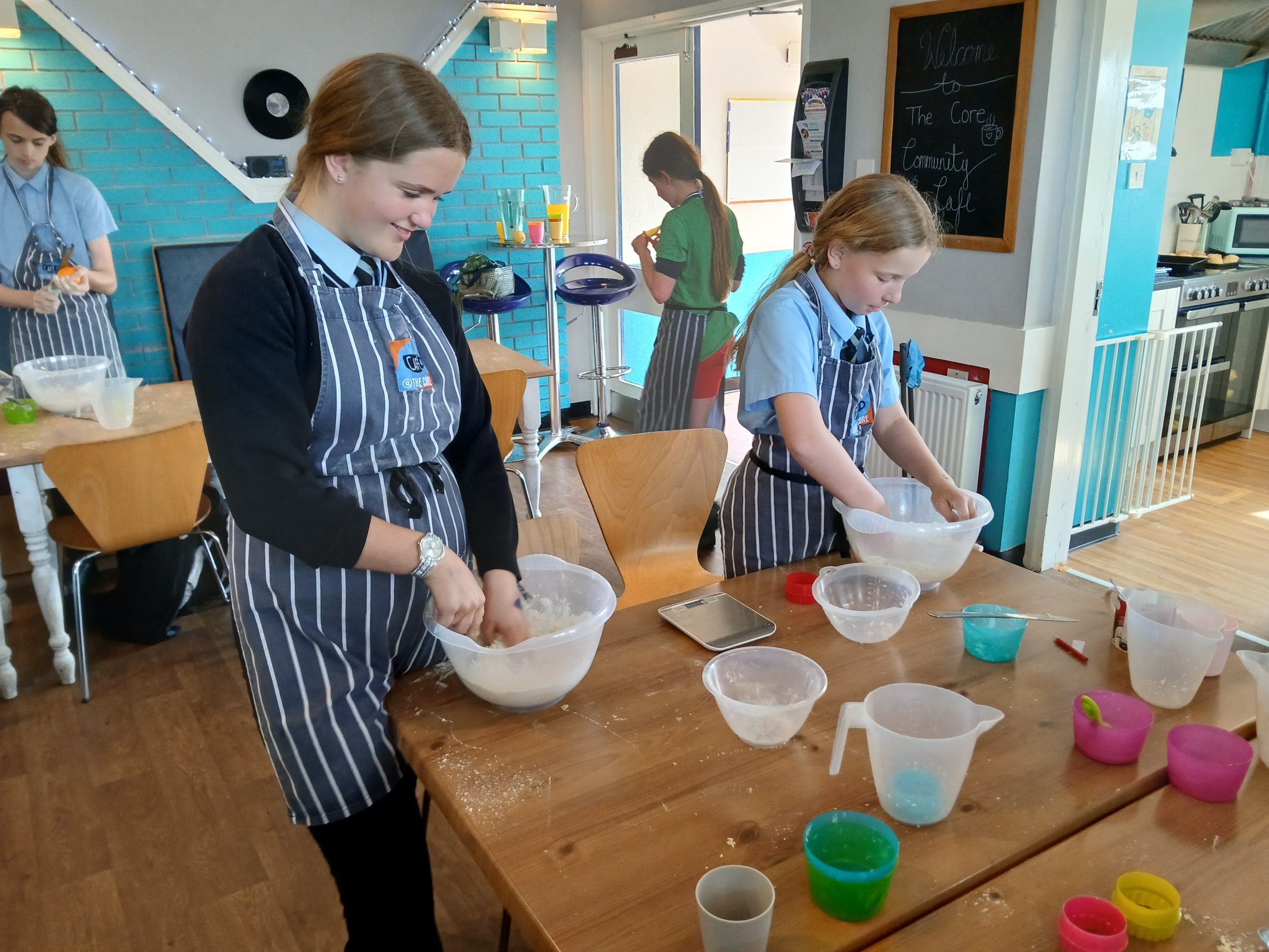 Recent recipients of the community grant scheme - young girls cooking