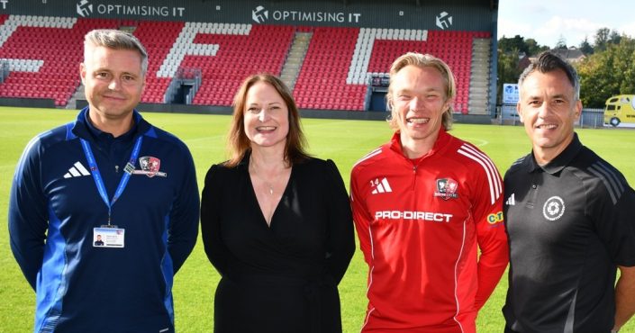L to R, Danny Harris, Head of Services for Exeter City Community Trust, Police and Crime Commissioner Alison Hernandez, Exeter City Football Club player Ilmari Niskanen, and Scott Walker, Community Liaison Executive South for the Professional Footballers’ Association (PFA) stood by the pitch at St James Park
