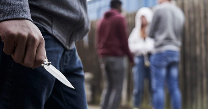 A pictured of someone's hand holding a knife