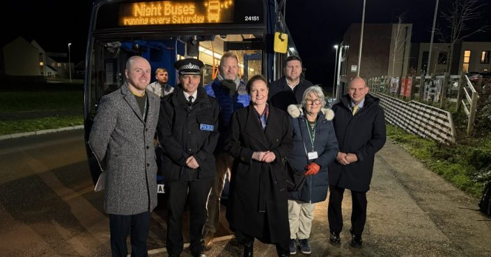 Key partners stood outside the night bus in Cranbrook