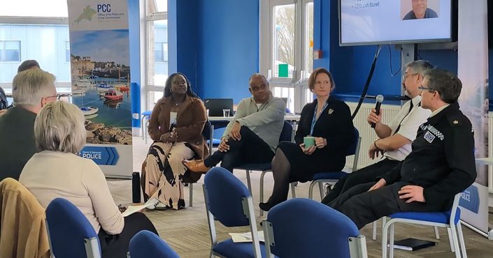 People sat in a circle as Councillor advocates policing protests