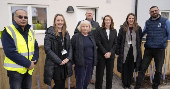 Left to right, Debansu Das, Business Development Director, Zed Pods; Sam Goff, Tenant Involvement Officer, Mid Devon District Council; Cllr Jane Lock, Cabinet Member for Housing, Assets and Property Services, Mid Devon District Council; Simon Newcombe, Head of Housing and Health, Mid Devon District Council; Sophie Baker, programme manager, Prisoners Building Homes; Hannah Loram, Commercial Services Officer, Mid Devon District Council; and Dr Rehan Khodabuccus, Operations and Technical Director, Zed Pods, stood outside the new homes in Hemyock