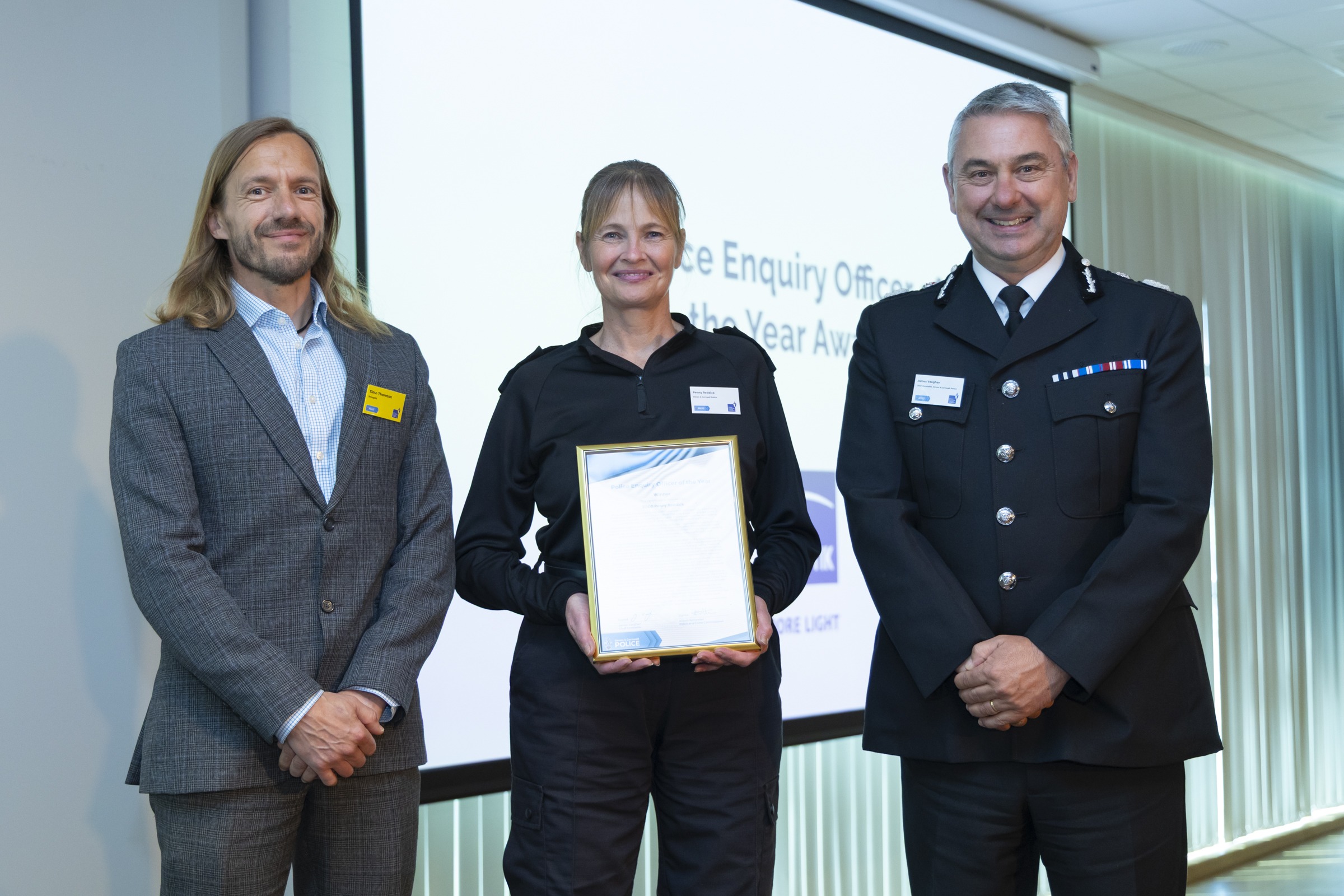 Penny Reddick, centre, Timo Thornton from award sponsor Jenoptik PLC, left, and Chief Constable James Vaughan, right