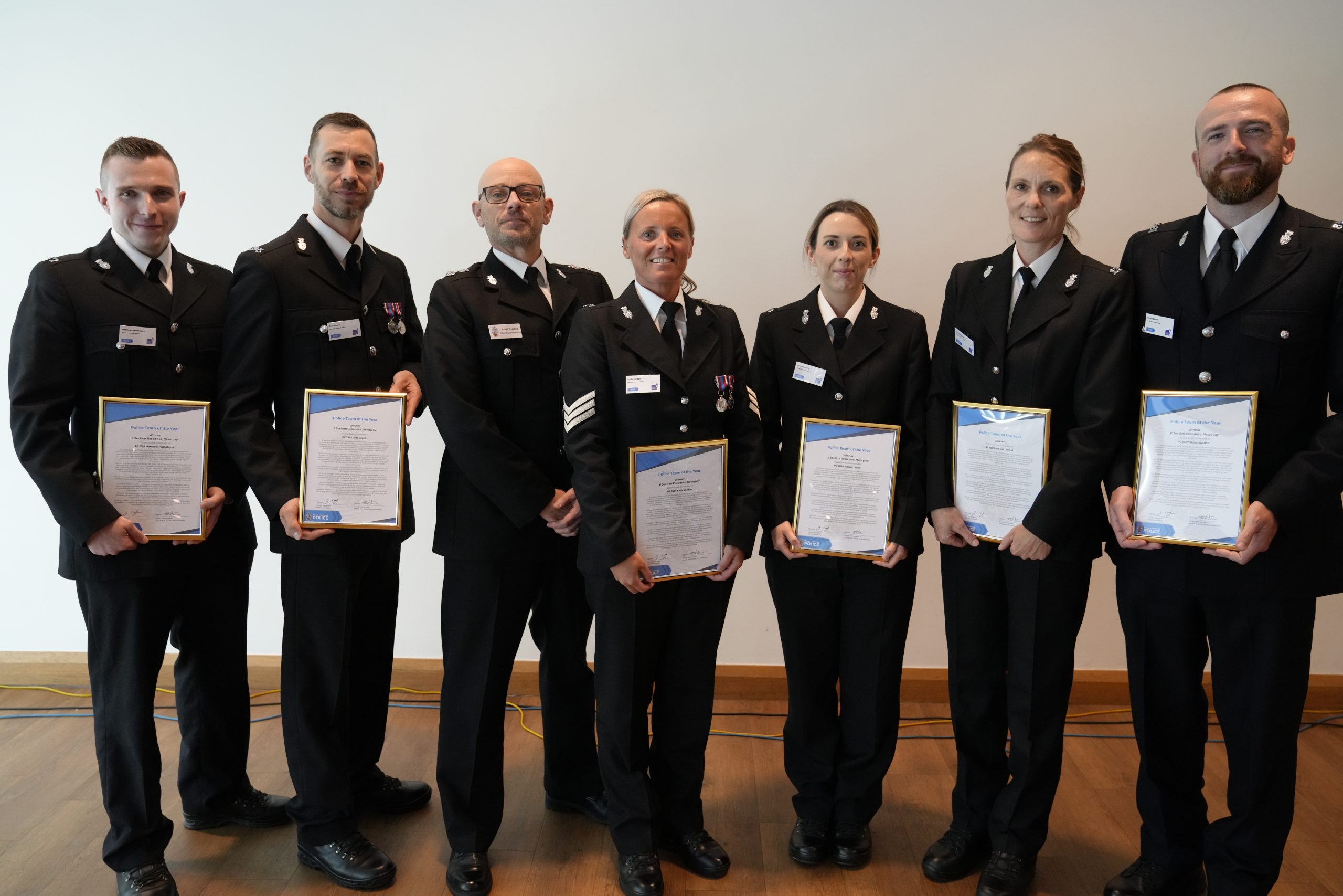 Police Team of the Year 2026 holding their certificates with Cornwall and Isles of Scilly Chief Superintendent Scott Bradley