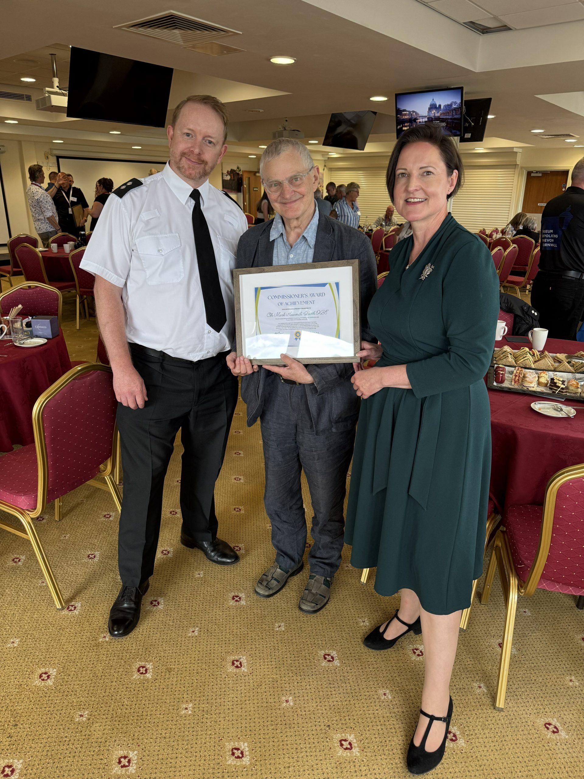 Councillor Mark Haworth-Booth OBE receiving his award